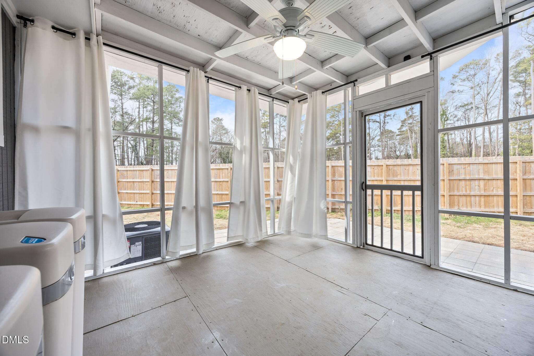 700 Woodland Road Raleigh, NC 27603 - Photo 19 of 35 a view of an empty room with a sliding door