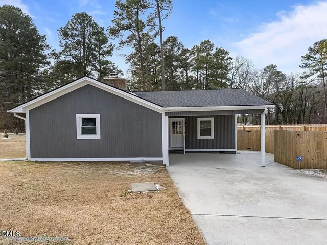 a house with trees in the background