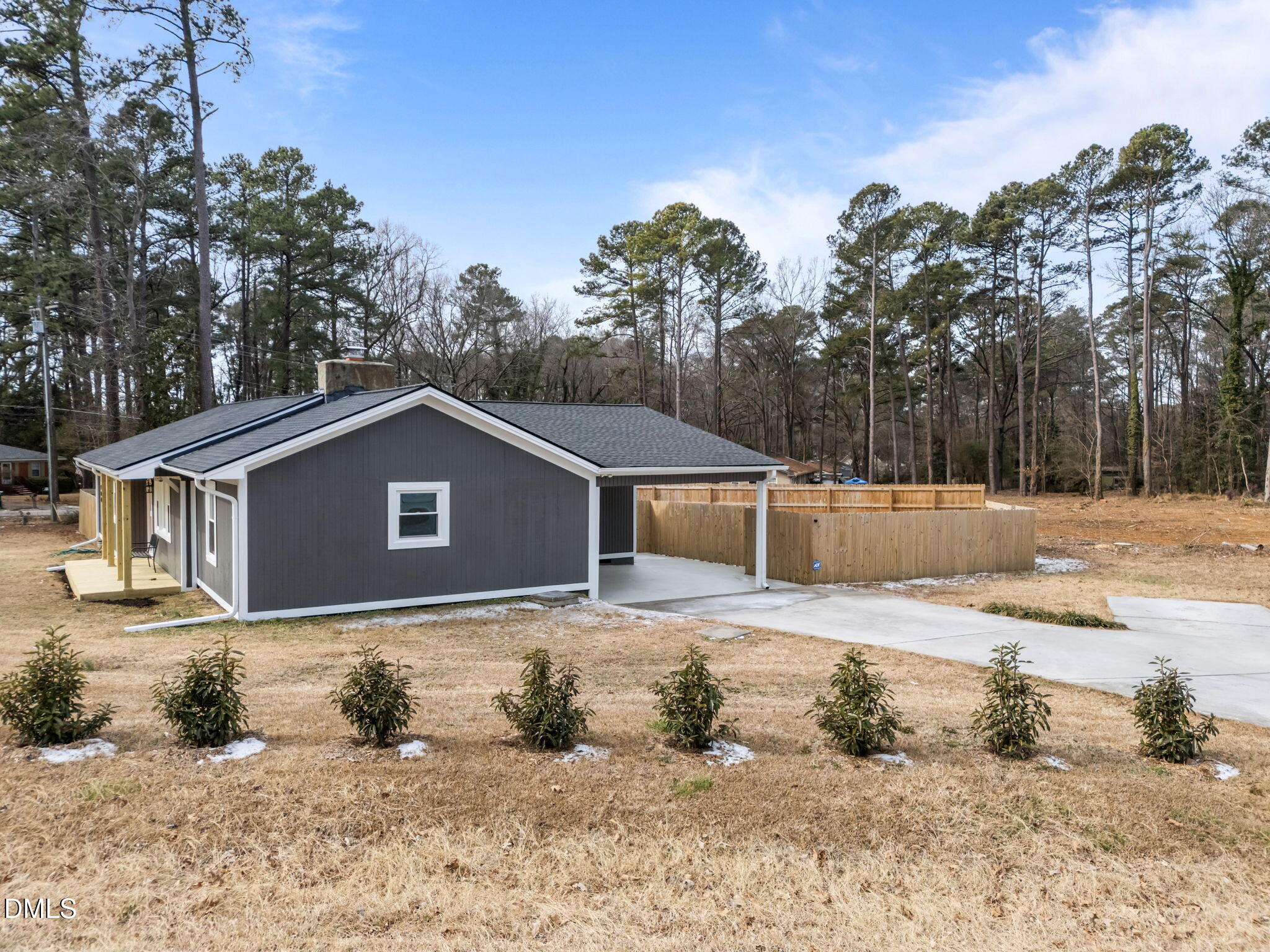 700 Woodland Road Raleigh, NC 27603 - Photo 31 of 35 a view of a house with a yard covered in snow
