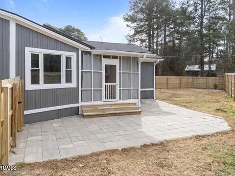 700 Woodland Road Raleigh, NC 27603 - Photo 35 of 35 a view of house with backyard and glass windows