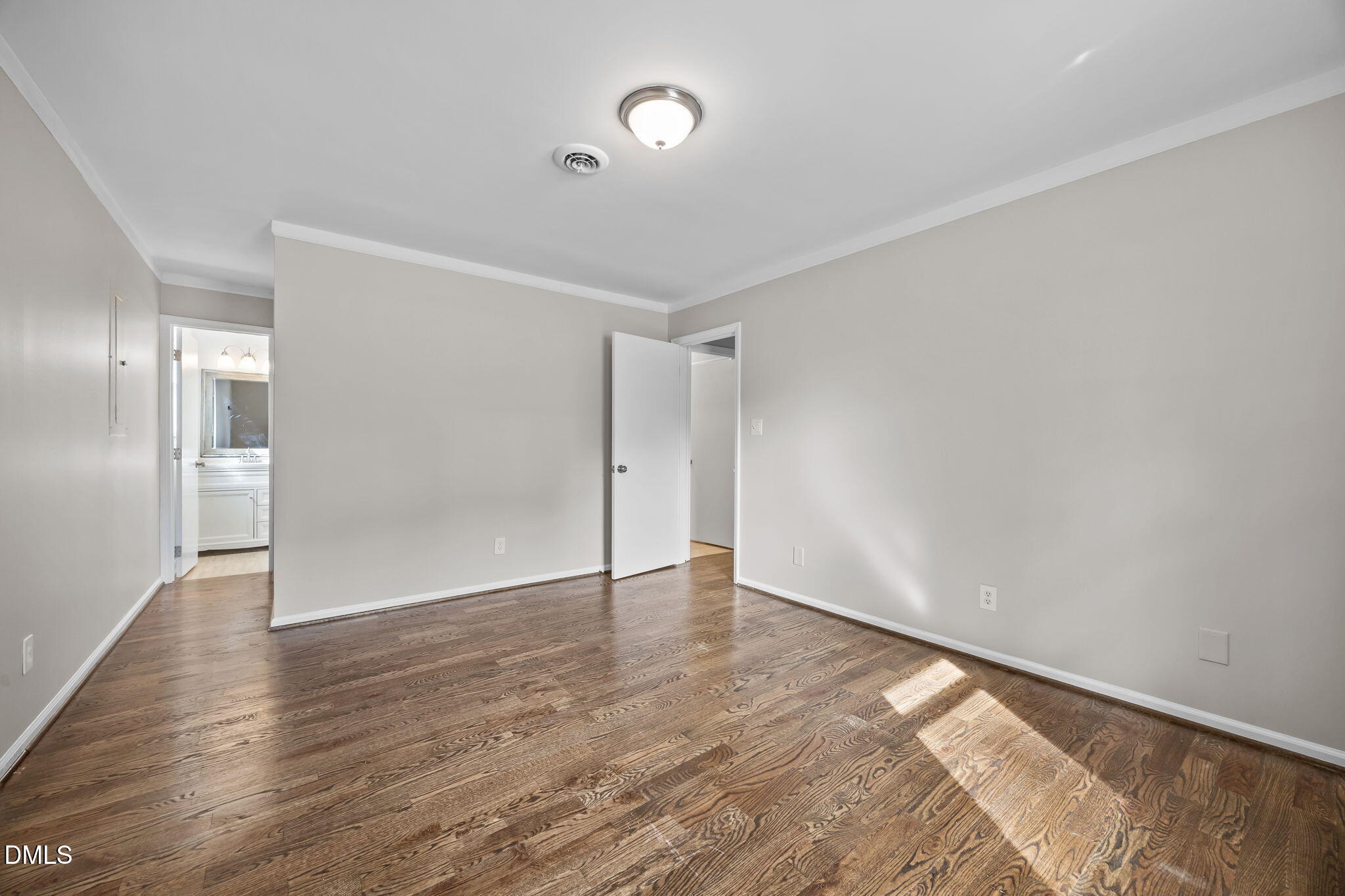 700 Woodland Road Raleigh, NC 27603 - Photo 9 of 35 a view of an empty room with wooden floor