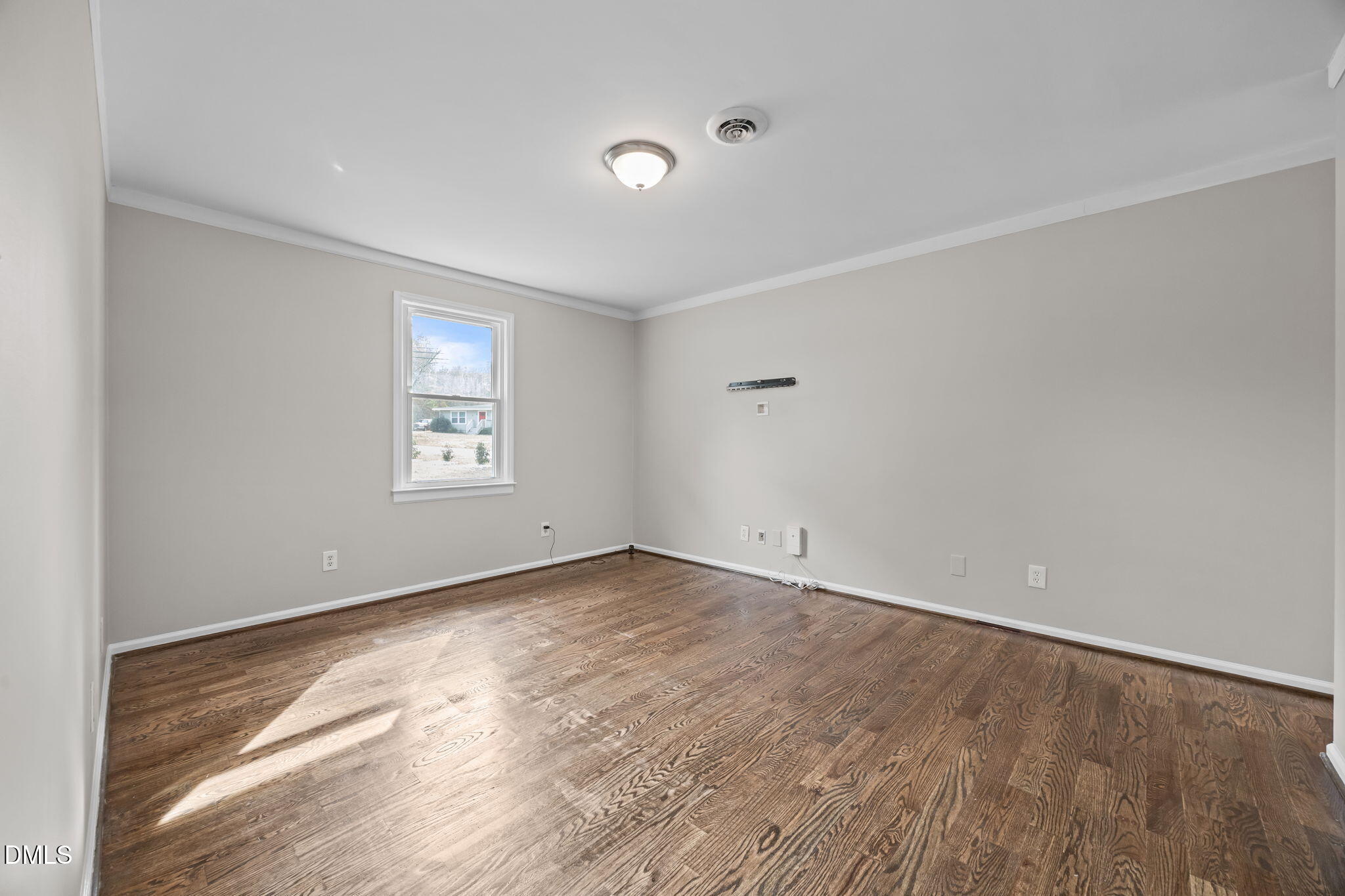700 Woodland Road Raleigh, NC 27603 - Photo 10 of 35 an empty room with windows