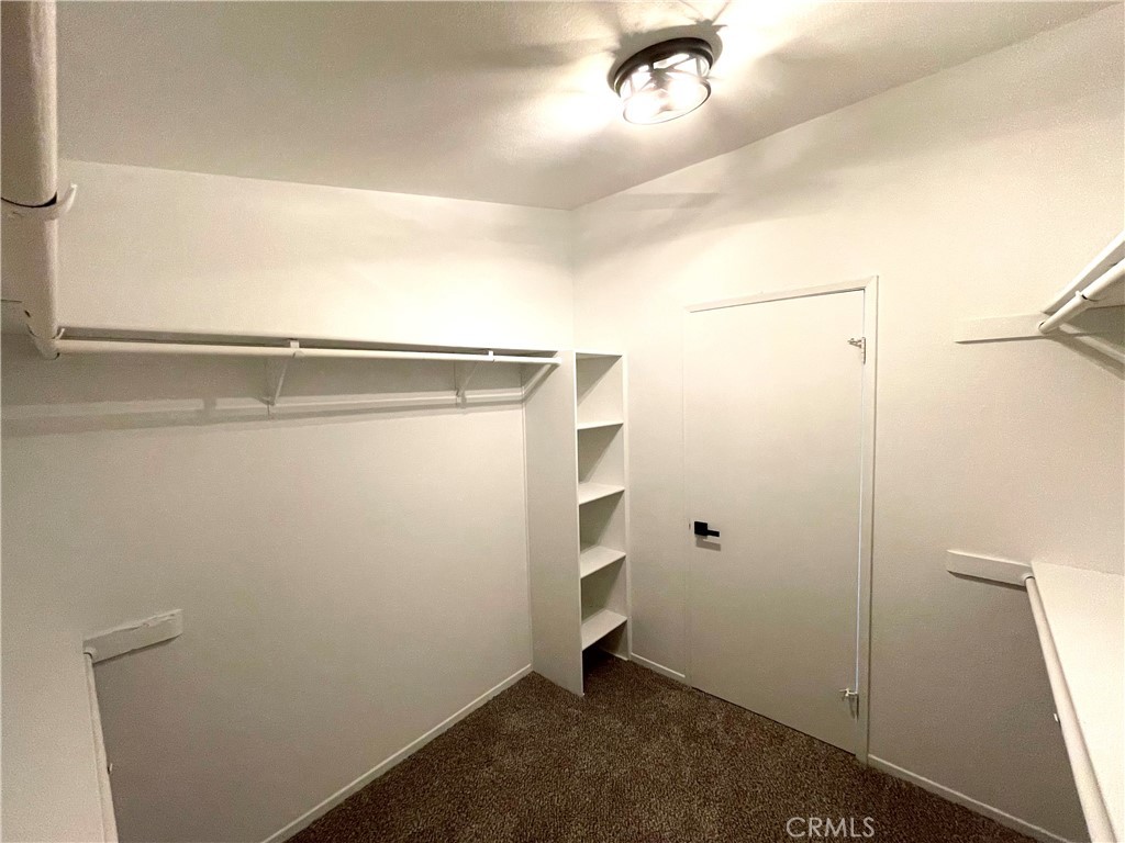 12546 Navajo Road Apple Valley, CA 92308 - Photo 8 of 27 Primary bedroom walk-in closet