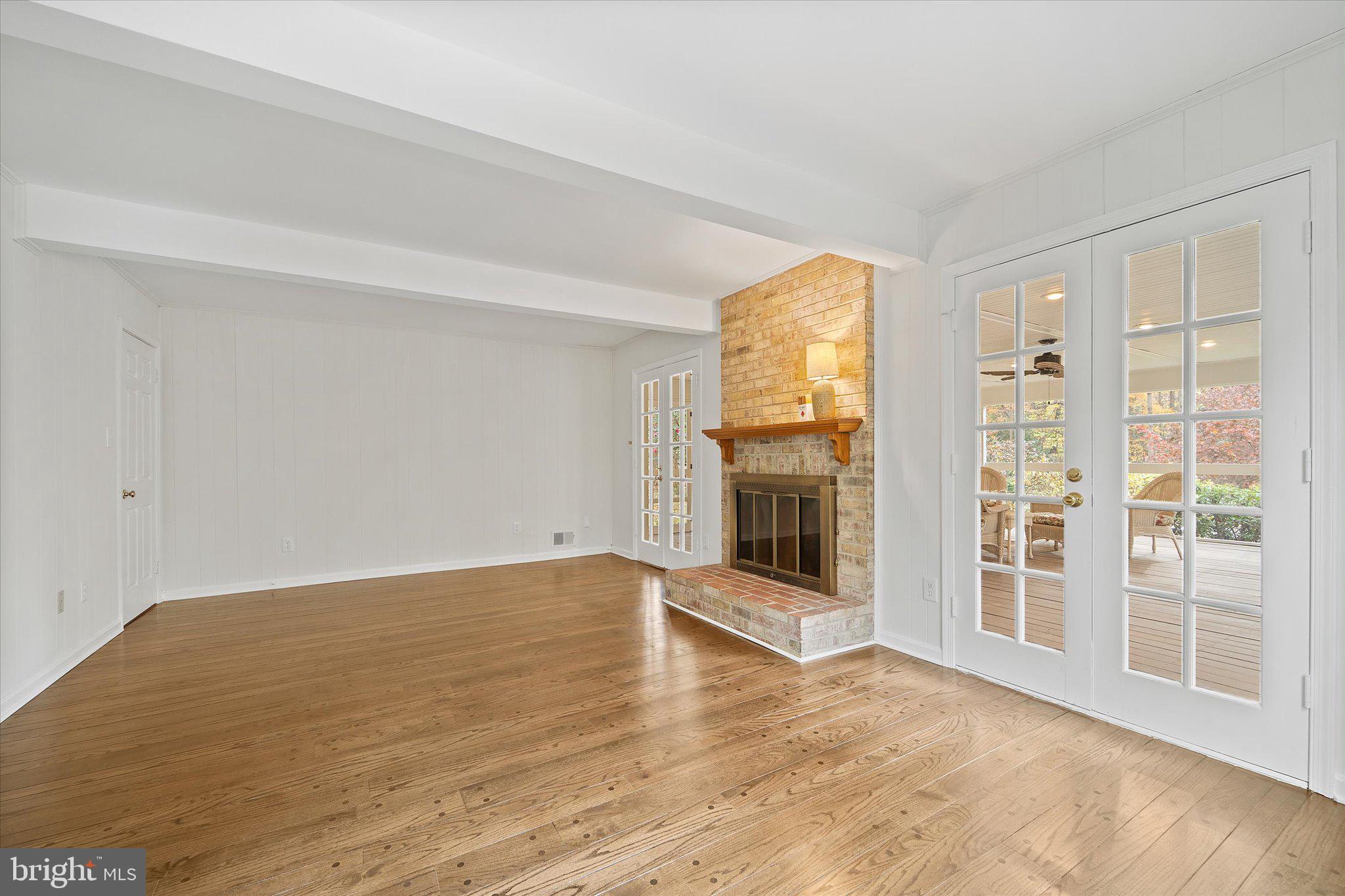 915 Welham Green Road Great Falls, VA 22066 - Photo 12 of 59 Family room with doors to sunroom