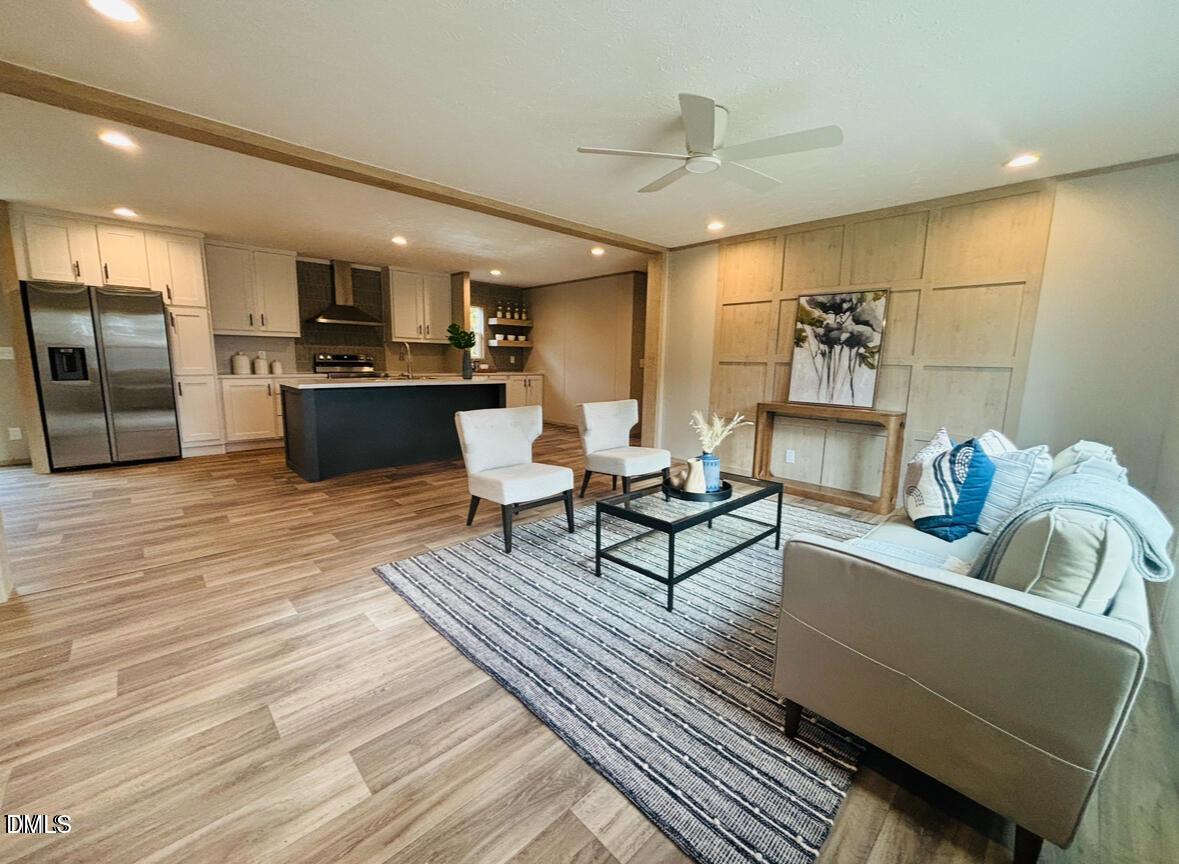 4285 Autry Mill Road Godwin, NC 28344 - Photo 3 of 19 a living room with furniture and kitchen view