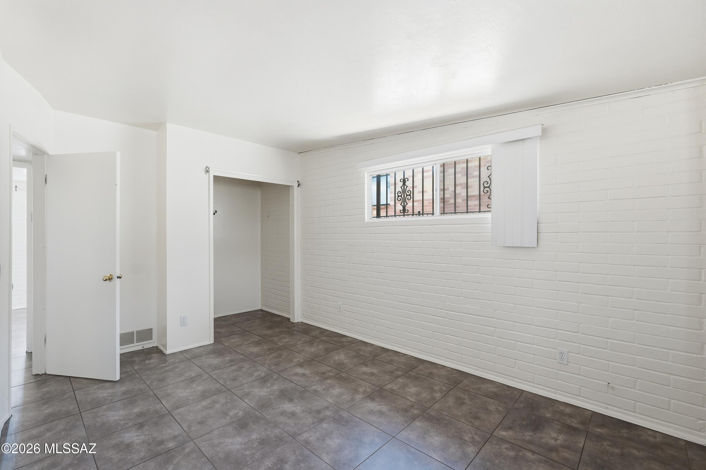 1808 West Caravelle Road Tucson, AZ 85713 - Photo 24 of 38 a view of an empty room with a window