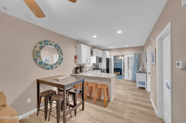 a very nice looking dining room with a dining table chairs and entryway