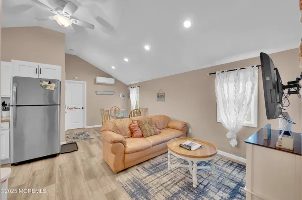 a living room with furniture and a rug