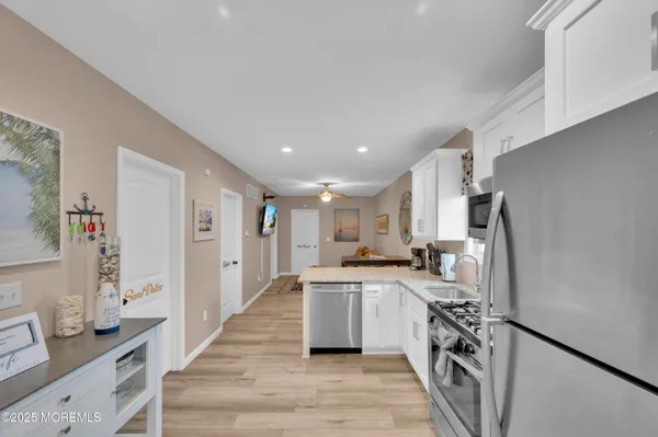 a kitchen with a sink stove and refrigerator