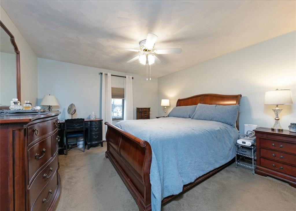 1267 Fall Lane Irwin, PA 15642 - Photo 15 of 22 a bedroom with a bed and a chandelier