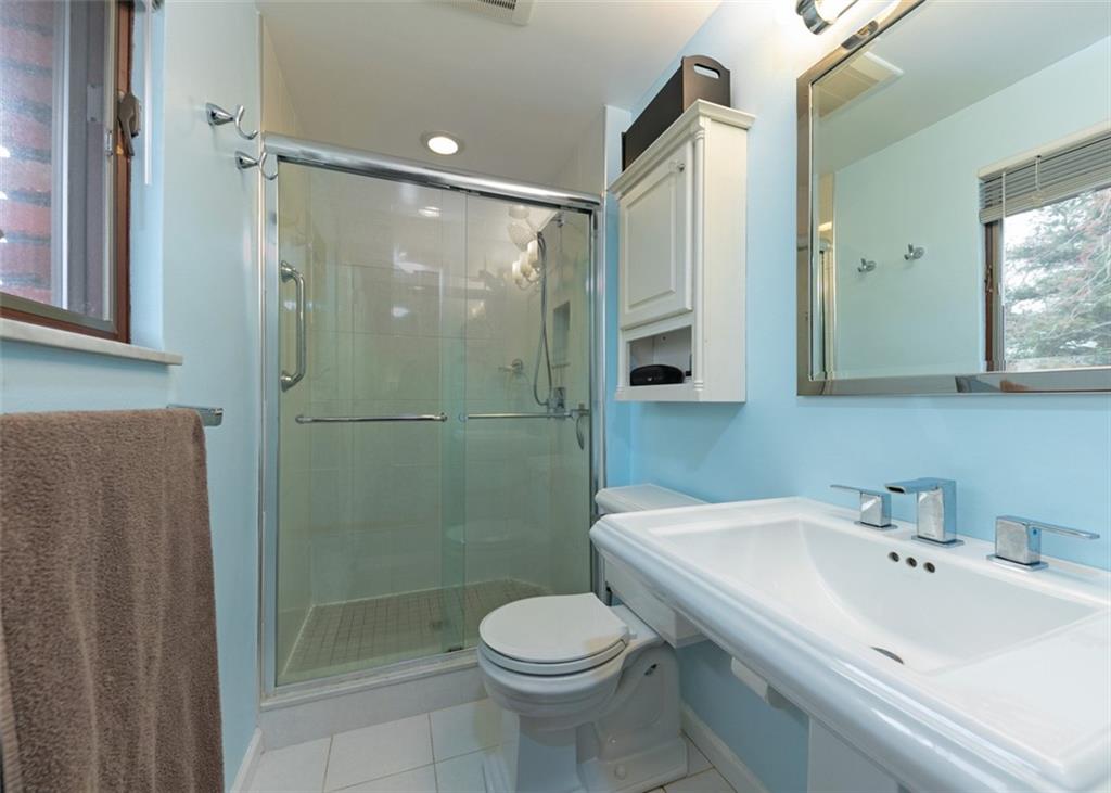 1267 Fall Lane Irwin, PA 15642 - Photo 18 of 22 a bathroom with a sink toilet and shower