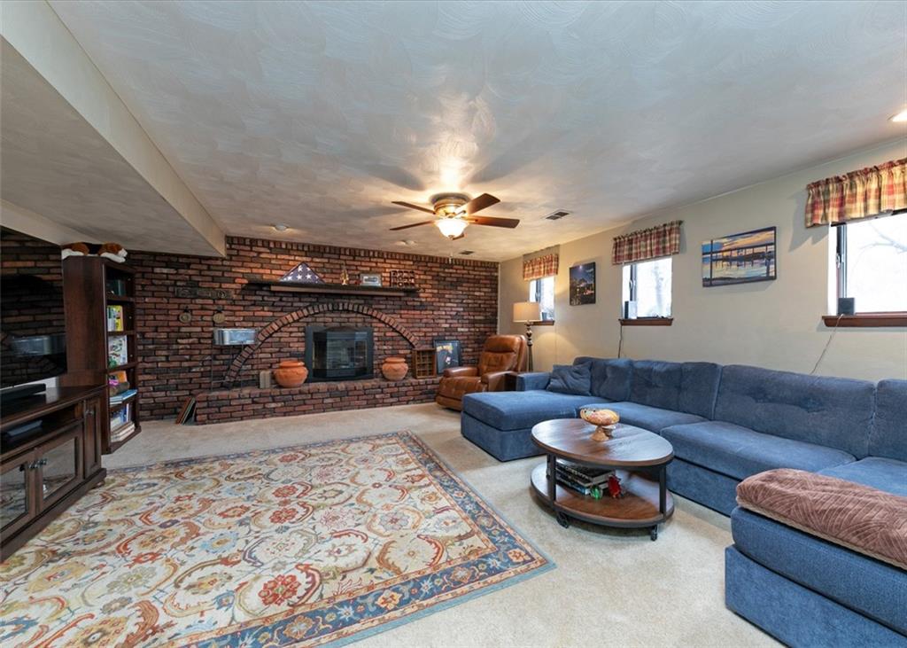 1267 Fall Lane Irwin, PA 15642 - Photo 19 of 22 a living room with furniture and a fireplace