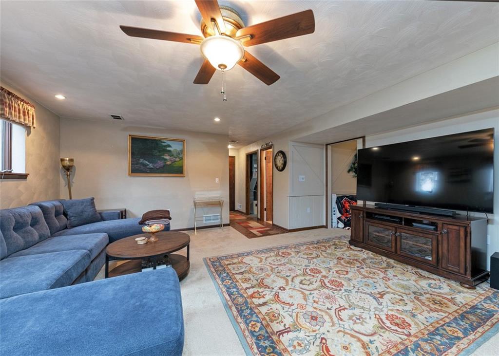 1267 Fall Lane Irwin, PA 15642 - Photo 20 of 22 a living room with furniture and a flat screen tv