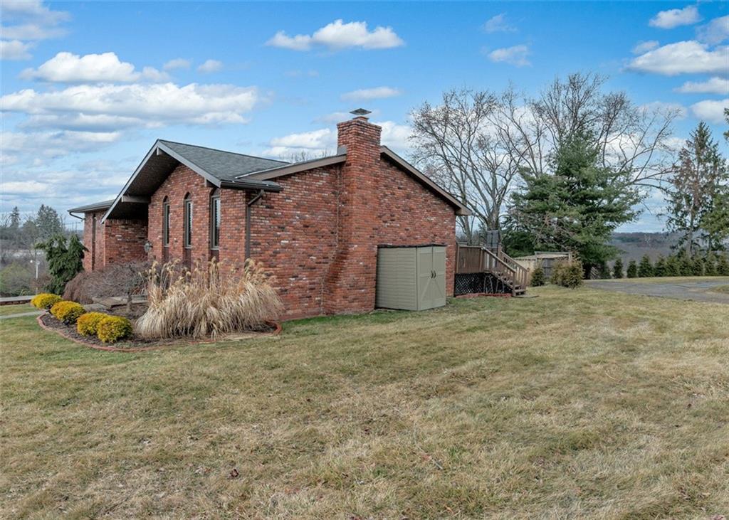 1267 Fall Lane Irwin, PA 15642 - Photo 2 of 22 a view of a house with a yard and fence