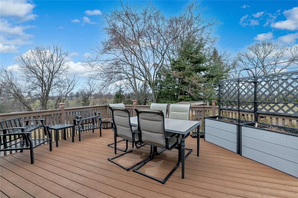 1267 Fall Lane Irwin, PA 15642 - Photo 3 of 22 a view of a chairs and table on the deck