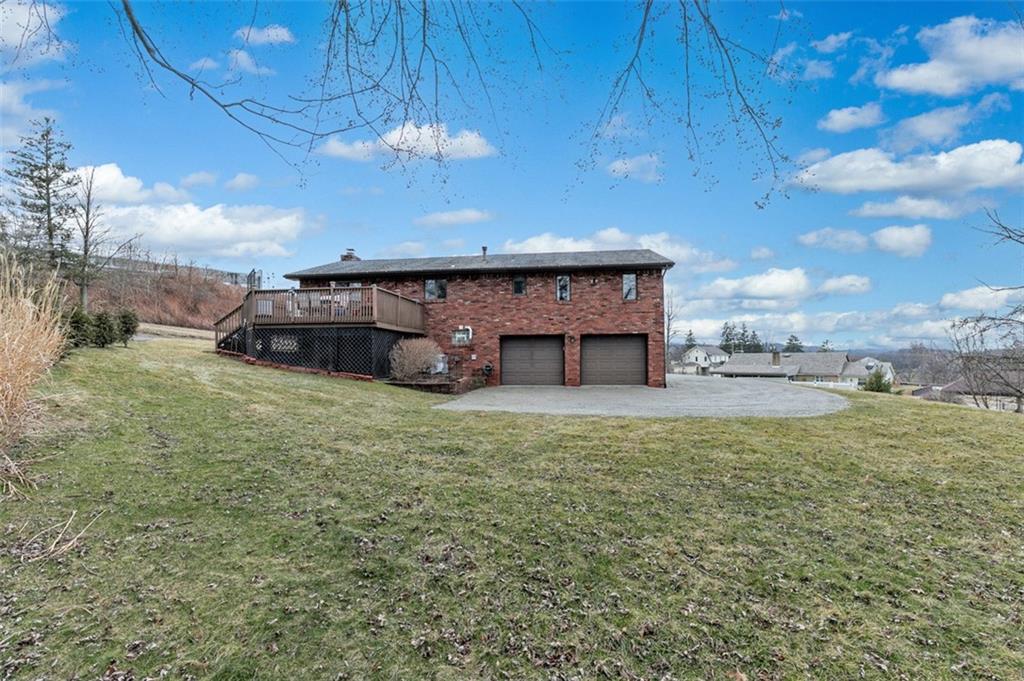 1267 Fall Lane Irwin, PA 15642 - Photo 5 of 22 a view of a house with a backyard