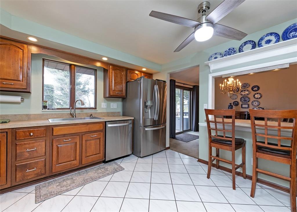 1267 Fall Lane Irwin, PA 15642 - Photo 10 of 22 a kitchen with stainless steel appliances granite countertop a refrigerator and a sink