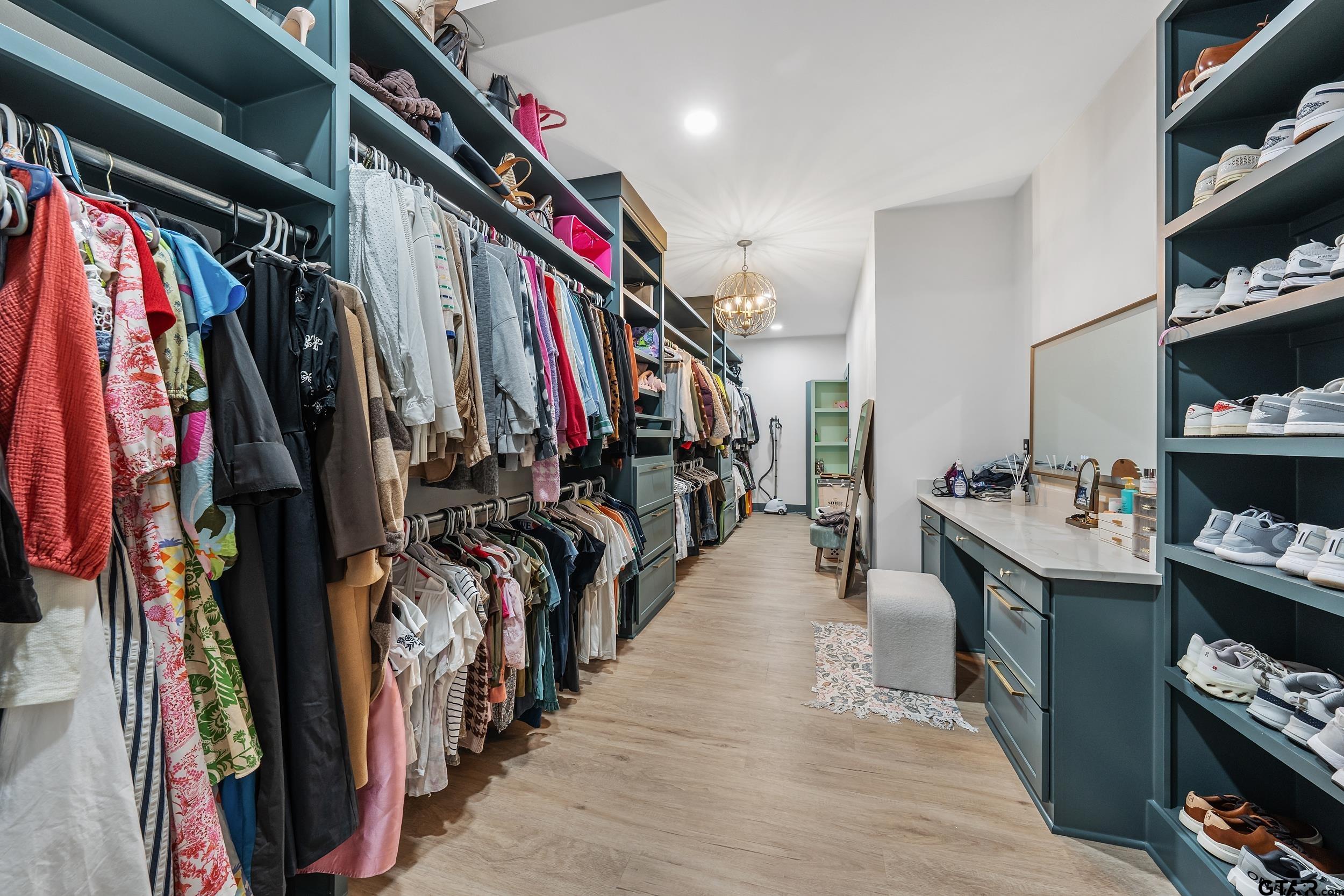 16837 Wilson Road Tyler, TX 75707 - Photo 24 of 44 a walk in closet with clothes and shoes