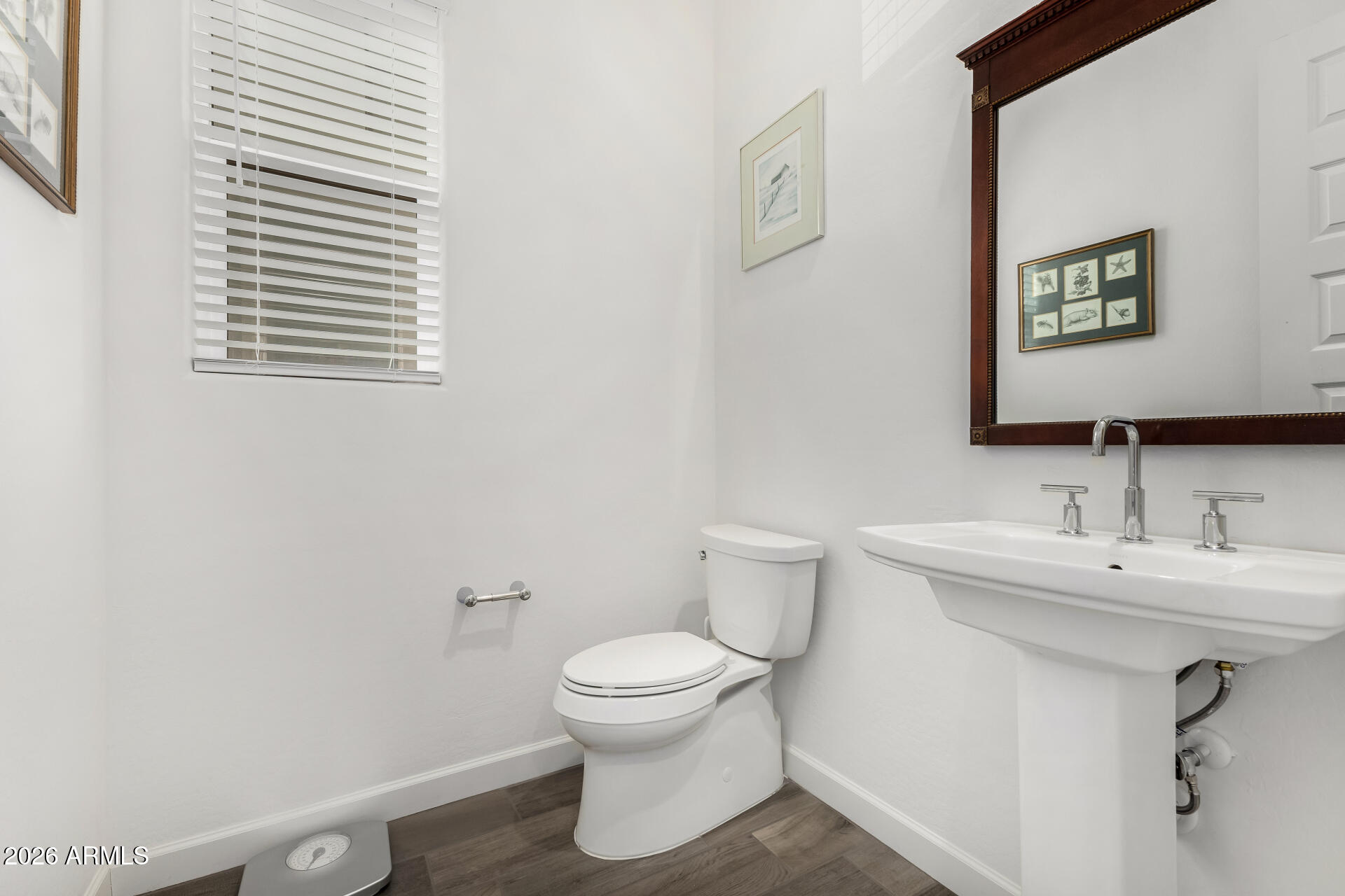 15544 South 181st Lane Goodyear, AZ 85338 - Photo 13 of 46 a bathroom with a toilet sink and mirror