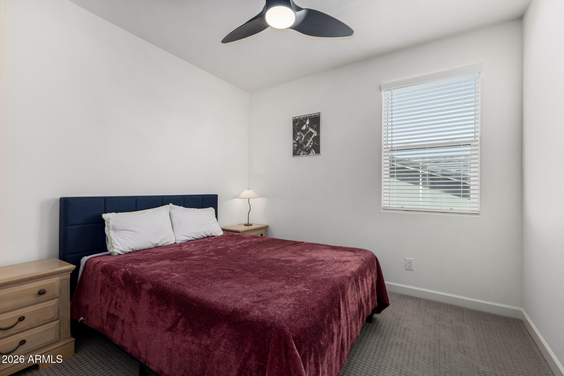 15544 South 181st Lane Goodyear, AZ 85338 - Photo 20 of 46 a bedroom with a bed and a window