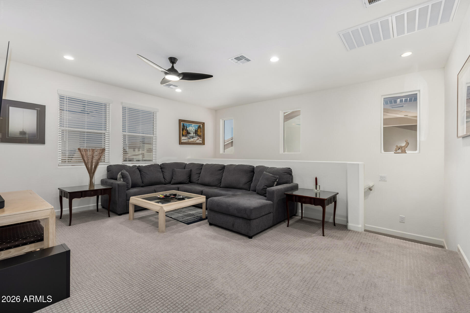 15544 South 181st Lane Goodyear, AZ 85338 - Photo 22 of 46 a living room with furniture and a ceiling fan