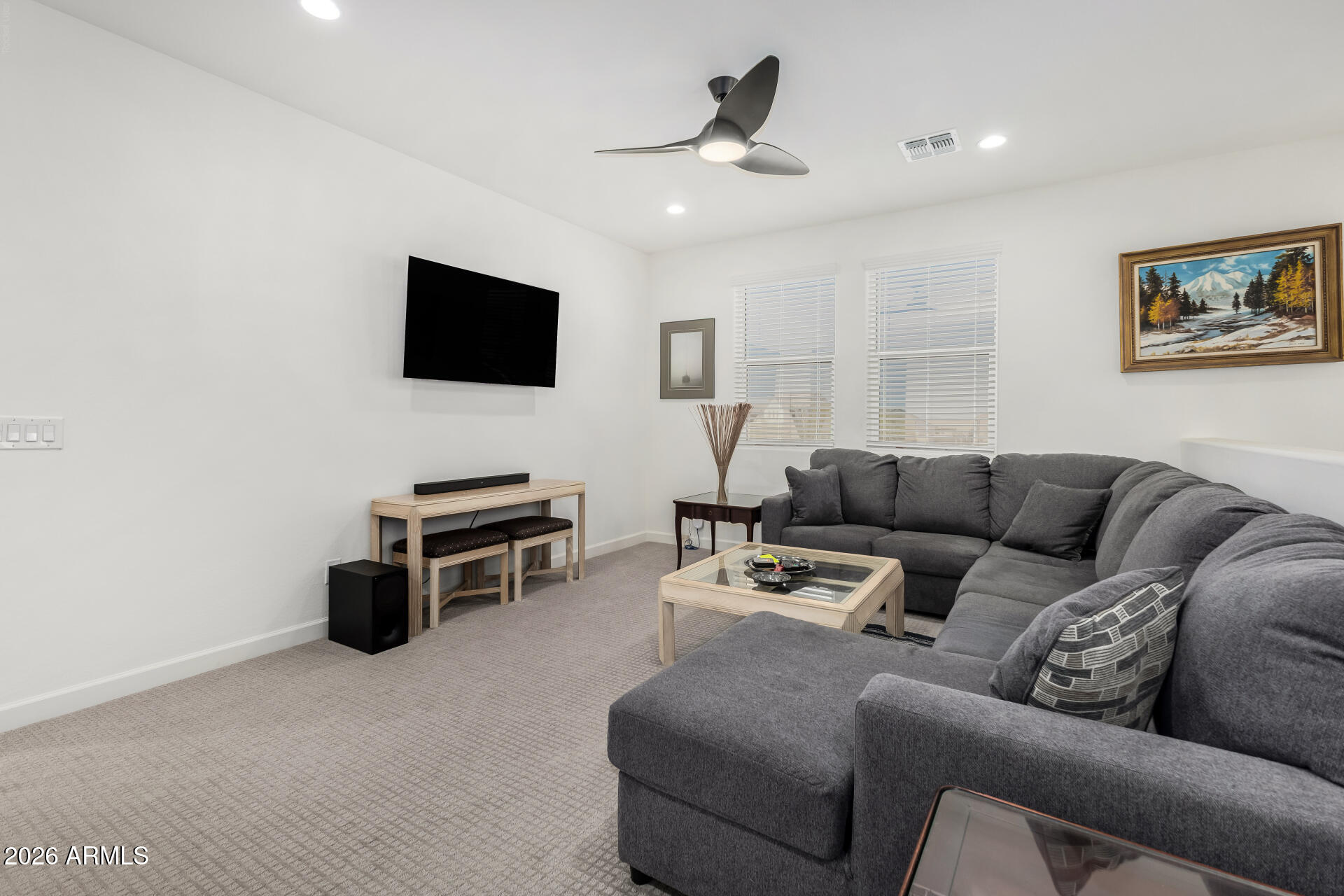 15544 South 181st Lane Goodyear, AZ 85338 - Photo 23 of 46 a living room with furniture and a flat screen tv