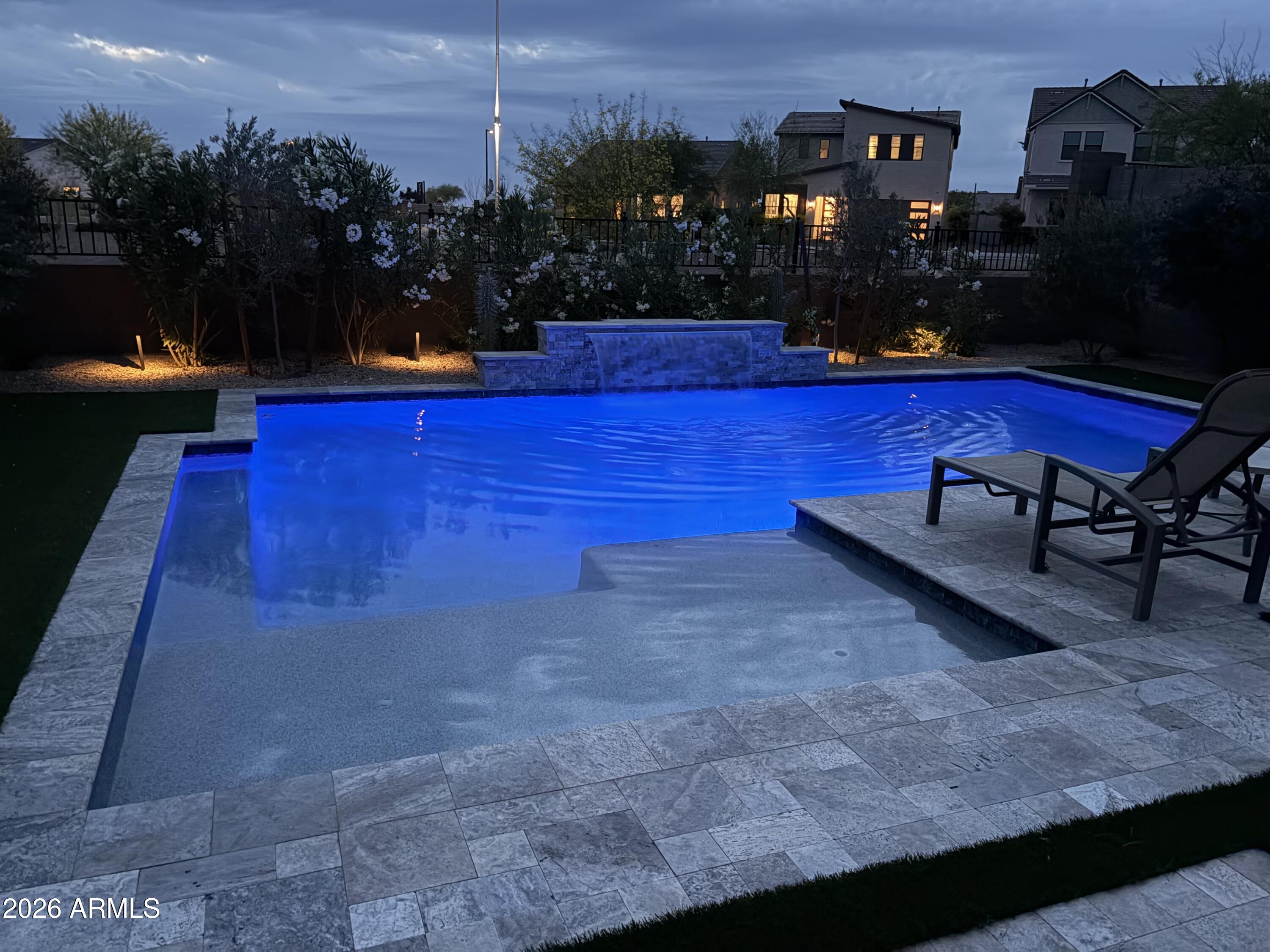 15544 South 181st Lane Goodyear, AZ 85338 - Photo 33 of 46 a view of swimming pool in a yard with lawn chairs