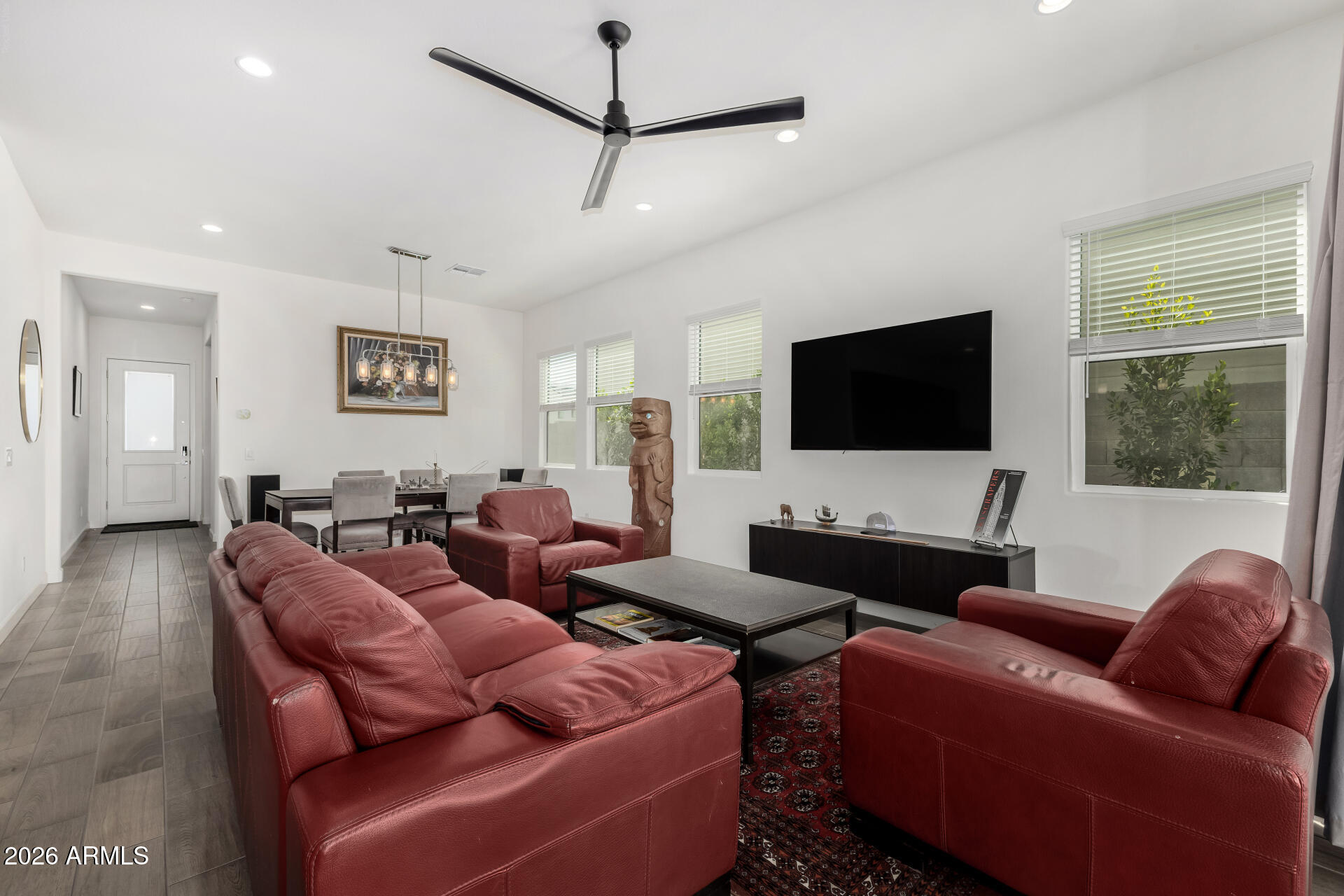 15544 South 181st Lane Goodyear, AZ 85338 - Photo 7 of 46 a living room with furniture and a flat screen tv