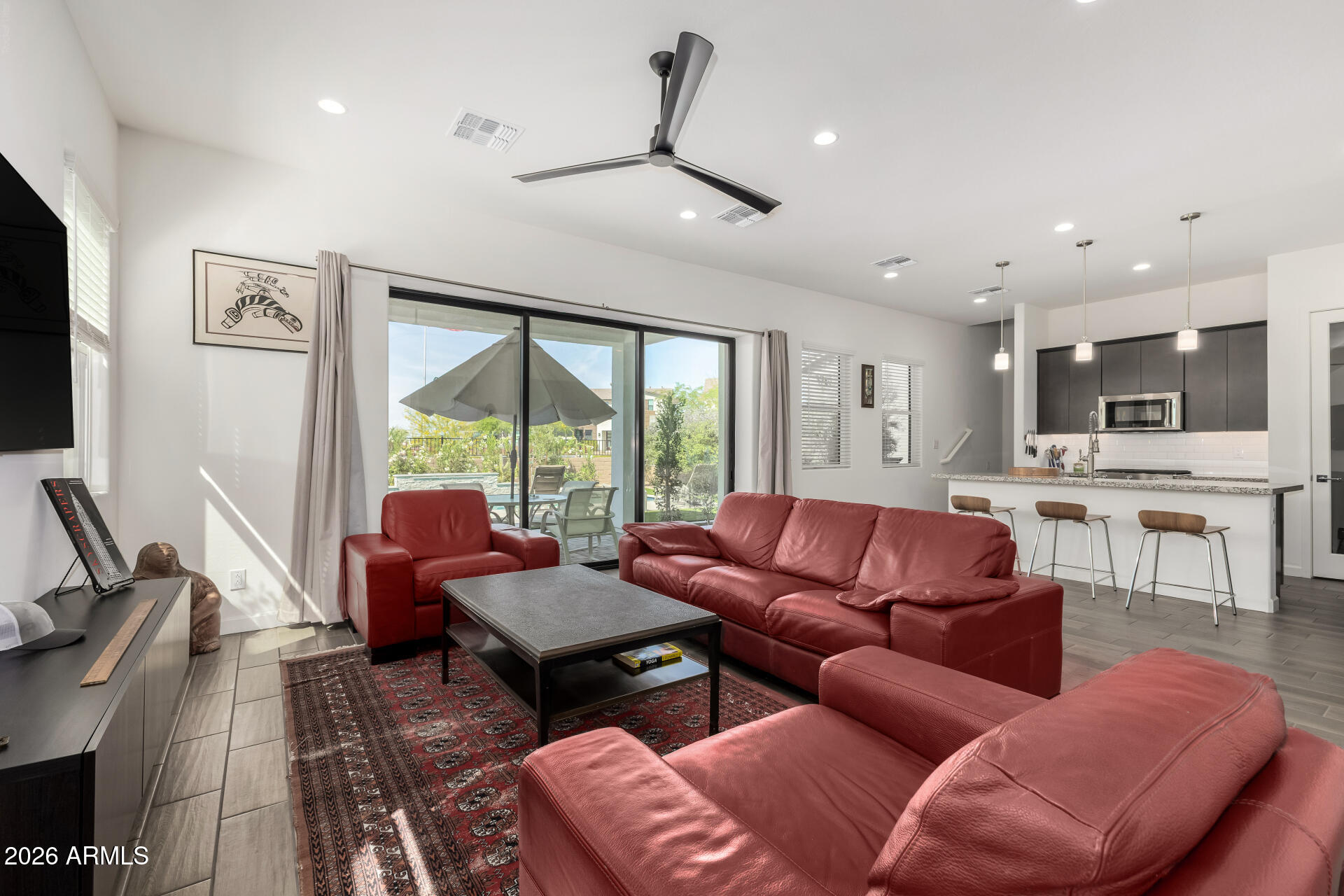 15544 South 181st Lane Goodyear, AZ 85338 - Photo 8 of 46 a living room with furniture and a large window