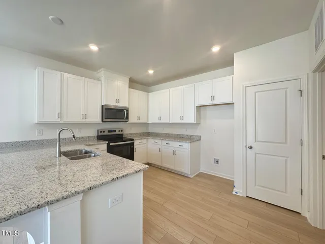 a view of kitchen and living room