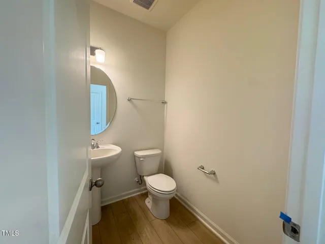 a kitchen with granite countertop white cabinets and stainless steel appliances