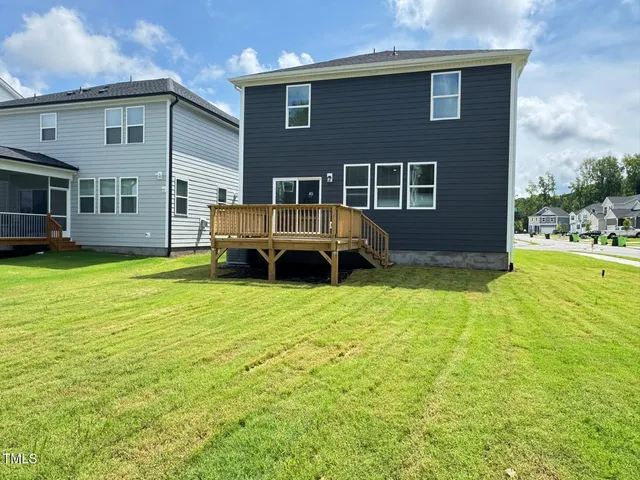 an outdoor view of garden with deck having patio