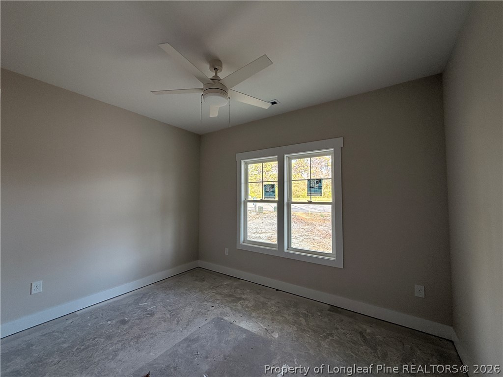 309 Elijah Way Vass, NC 28394 - Photo 4 of 8 an empty room with a window