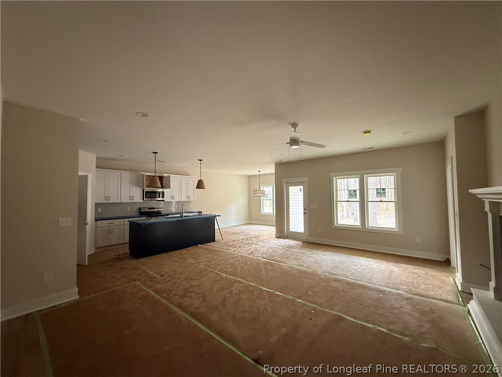 309 Elijah Way Vass, NC 28394 - Photo 5 of 8 a large room with a large window