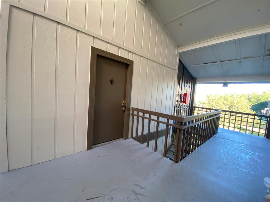 6519 West Newberry Road, Unit 1211 Gainesville, FL 32605 - Photo 2 of 10 a view of a porch with wooden floor