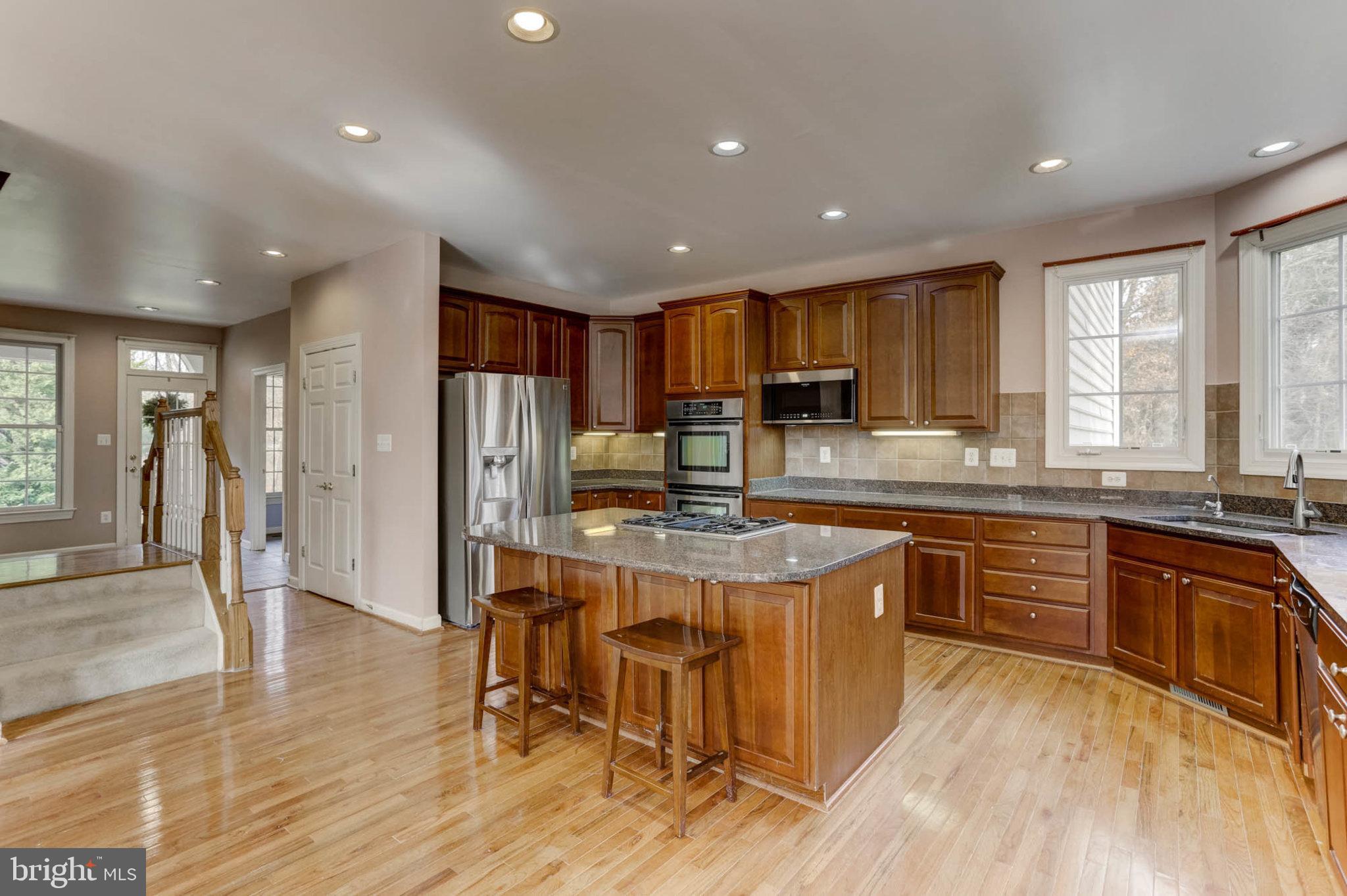 2014 Drovers Lane Cooksville, MD 21723 - Photo 17 of 55 Large Center Island & back stairs to Upper-Level