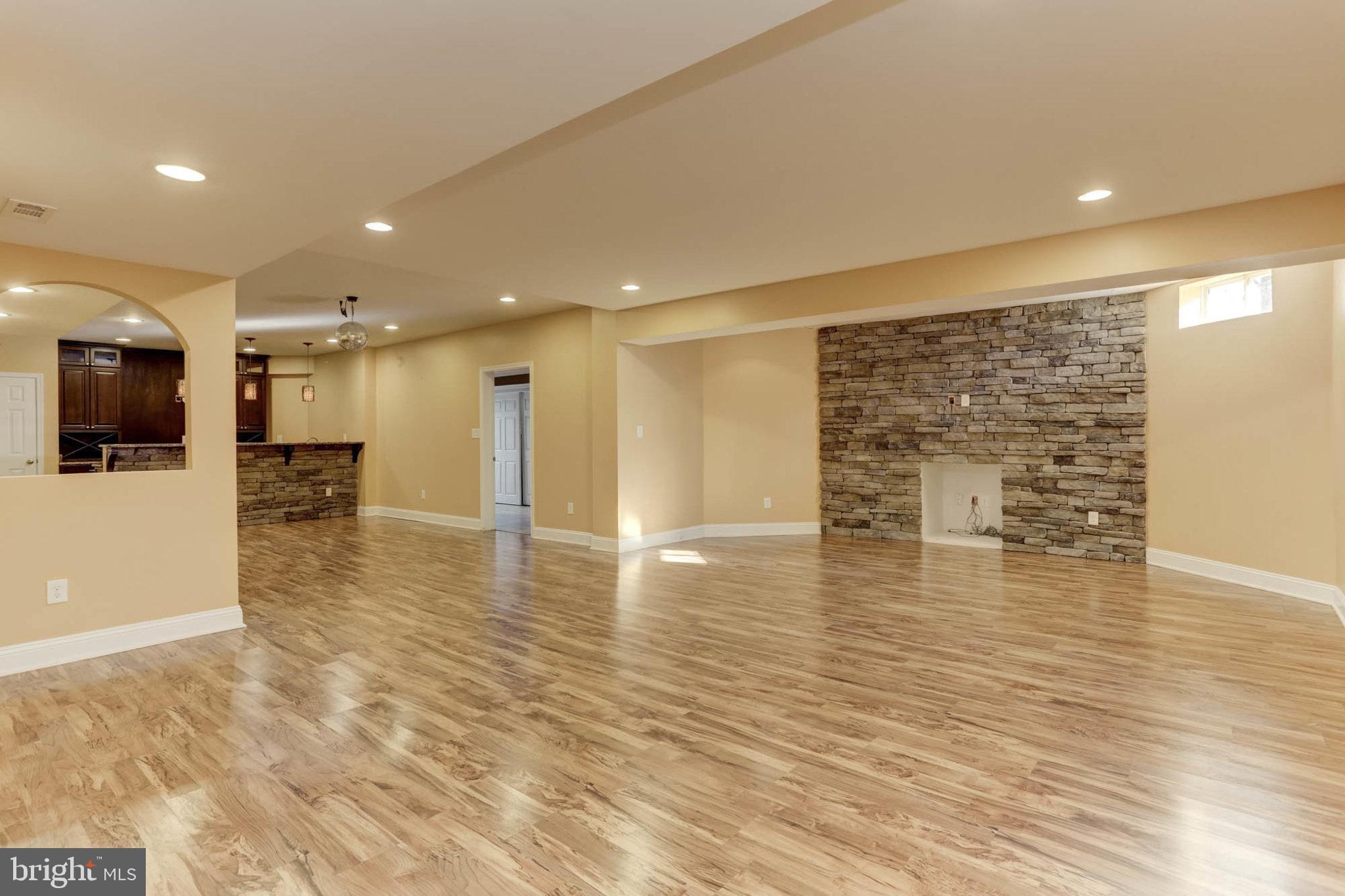 2014 Drovers Lane Cooksville, MD 21723 - Photo 38 of 55 New Laminate plank floors & stone accent wall