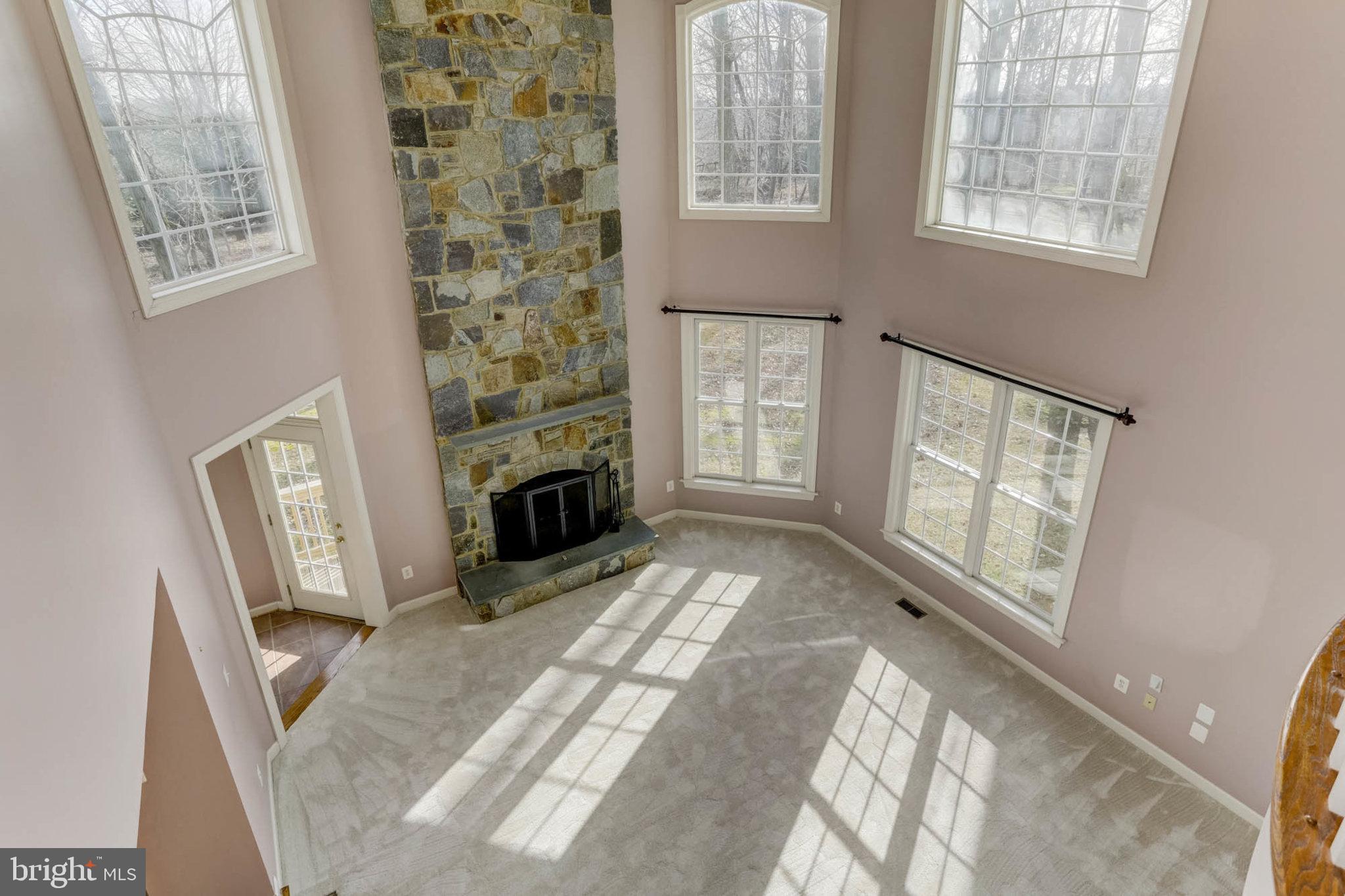 2014 Drovers Lane Cooksville, MD 21723 - Photo 10 of 55 Soaring Ceilings & stone fplace encased w/ windows