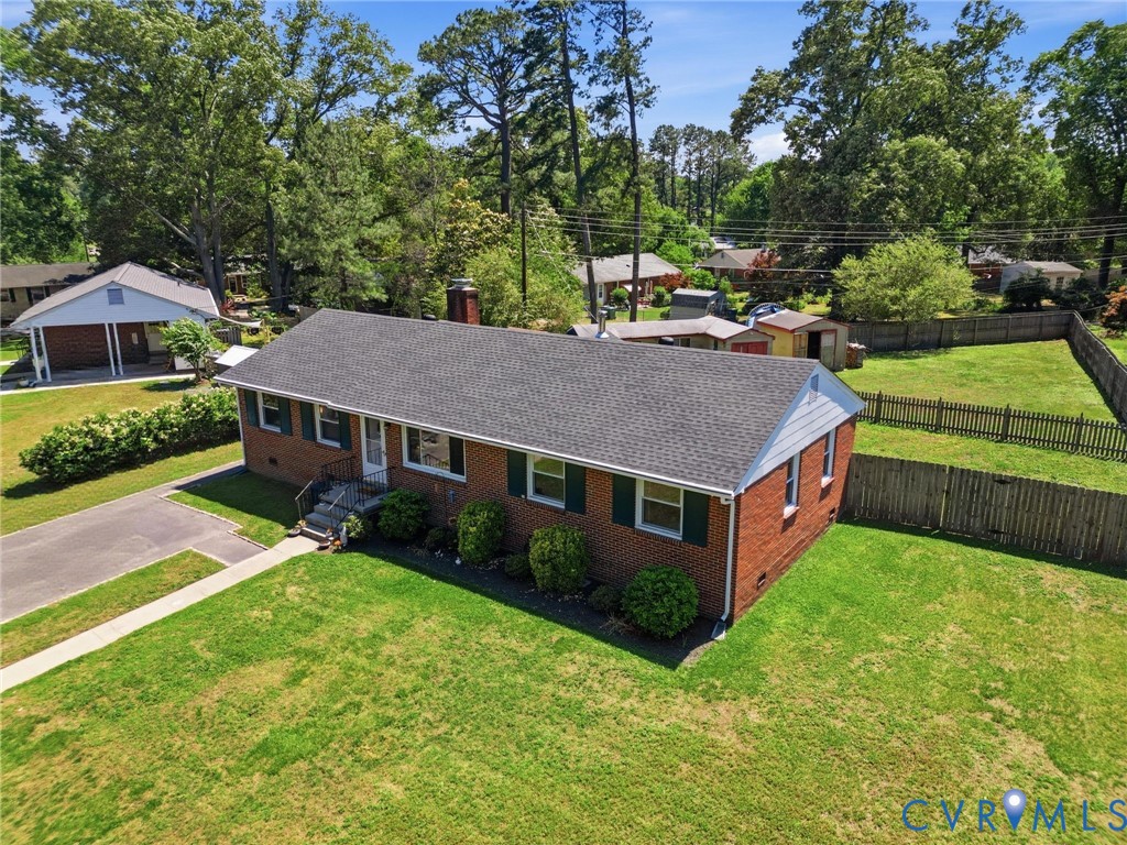 2403 Omega Road Henrico, VA 23228 - Photo 35 of 39 a aerial view of a house with a yard table and chairs