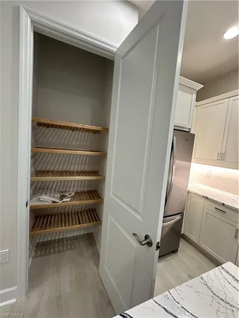 a kitchen with a cabinets and a stove top oven