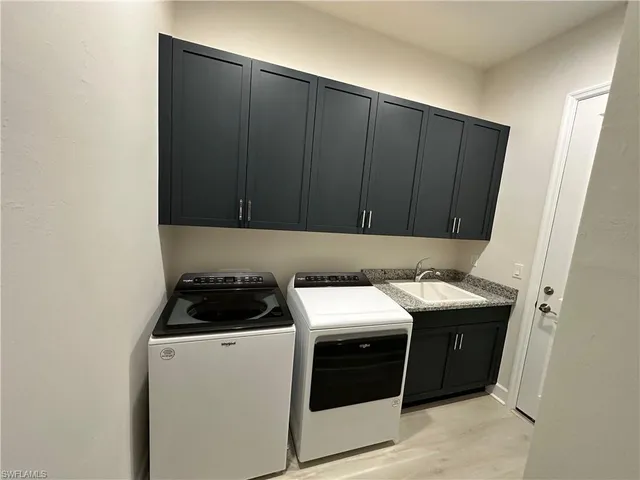 a kitchen with a cabinets and a stove top oven
