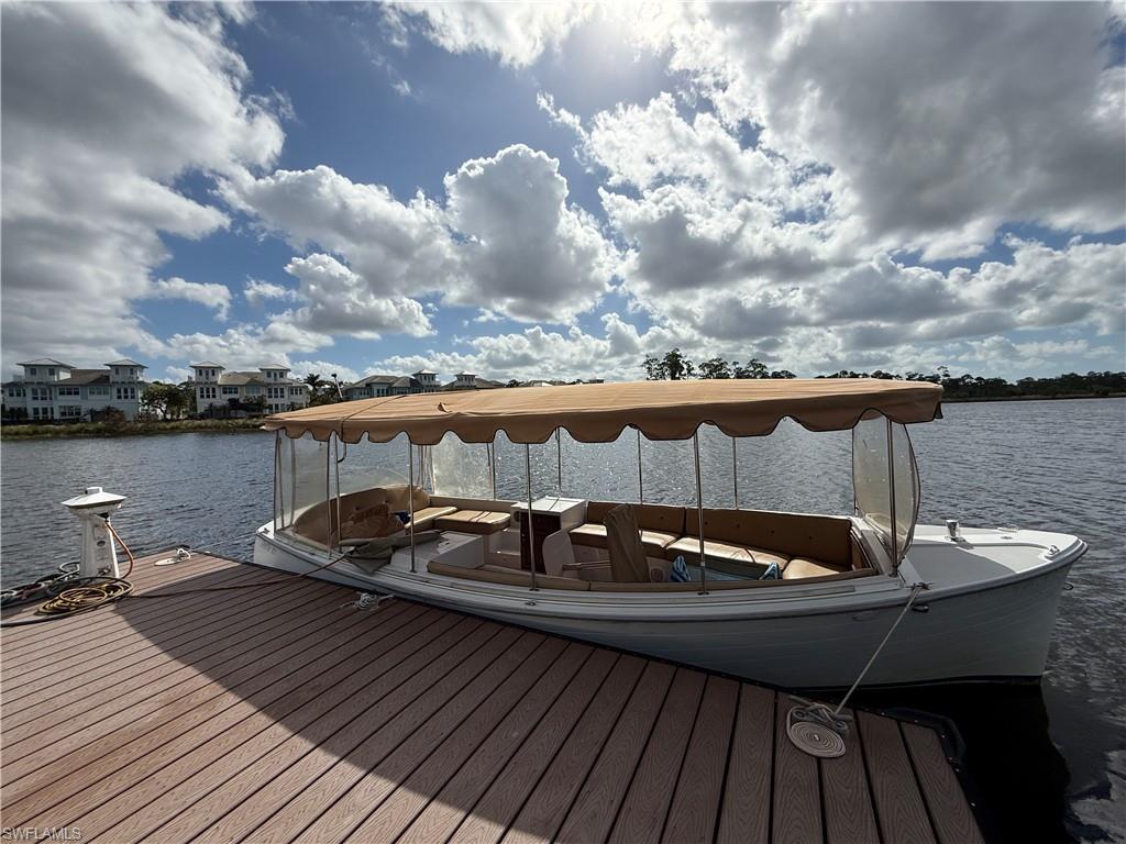 7255 Saona Court Naples, FL 34113 - Photo 24 of 28 a view of a roof deck with table and chairs