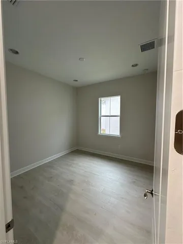 an empty room with windows
