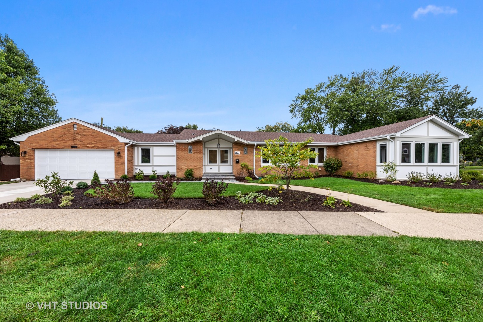 474 Uvedale Court Riverside, IL 60546 - Photo 1 of 23 a front view of a house with a yard