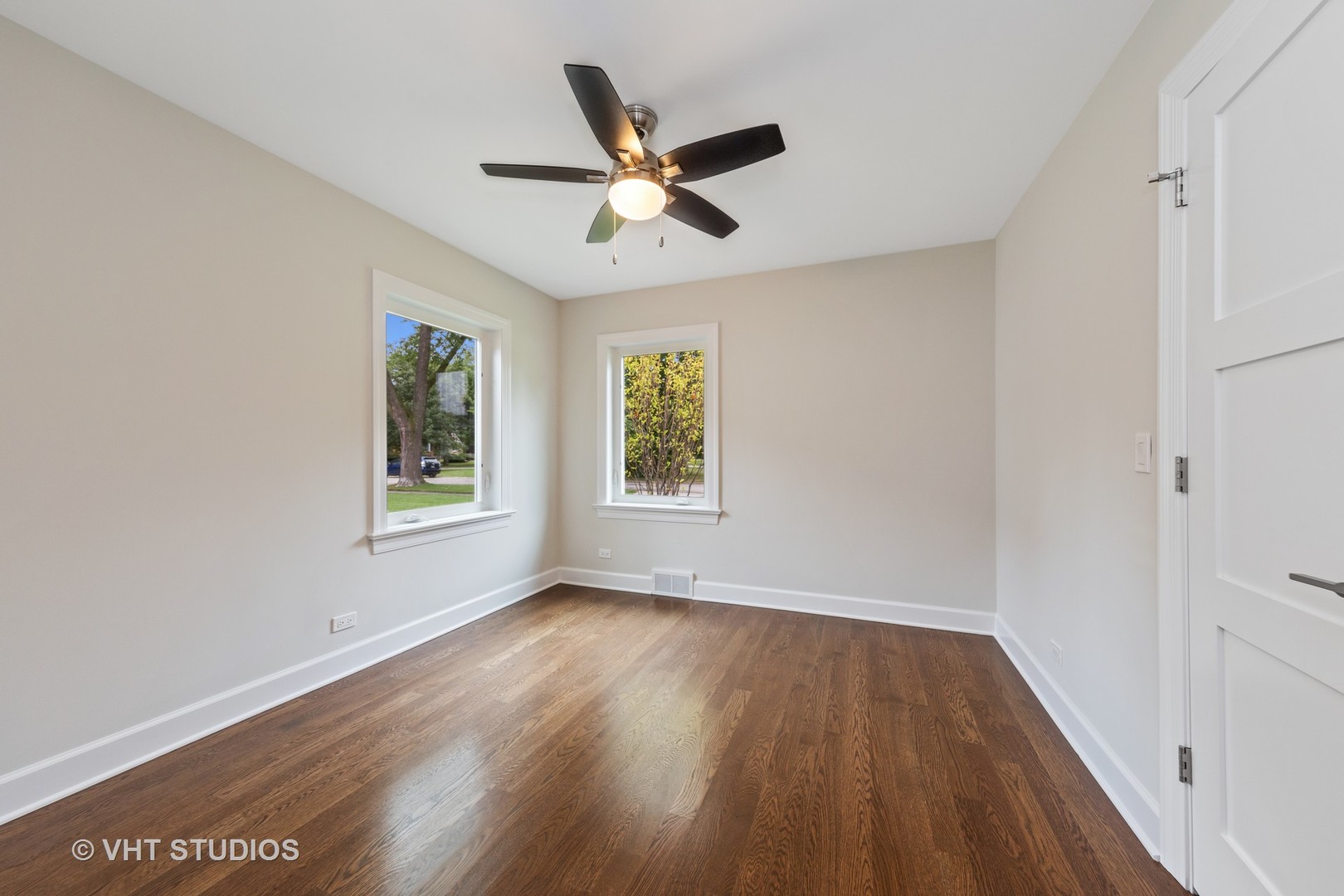 474 Uvedale Court Riverside, IL 60546 - Photo 14 of 23 a view of an empty room with wooden floor and a window