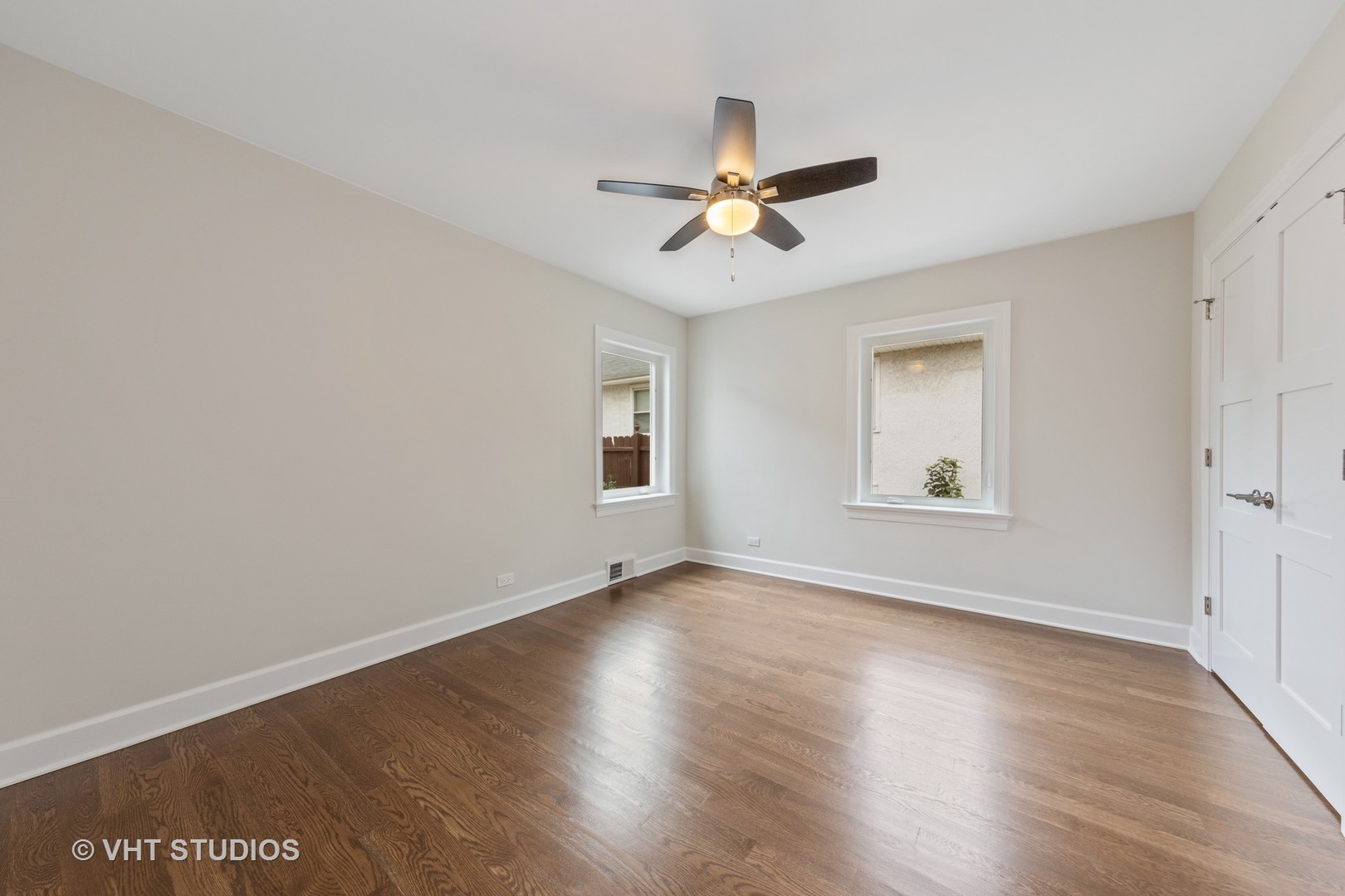 474 Uvedale Court Riverside, IL 60546 - Photo 15 of 23 a view of empty room with wooden floor and fan