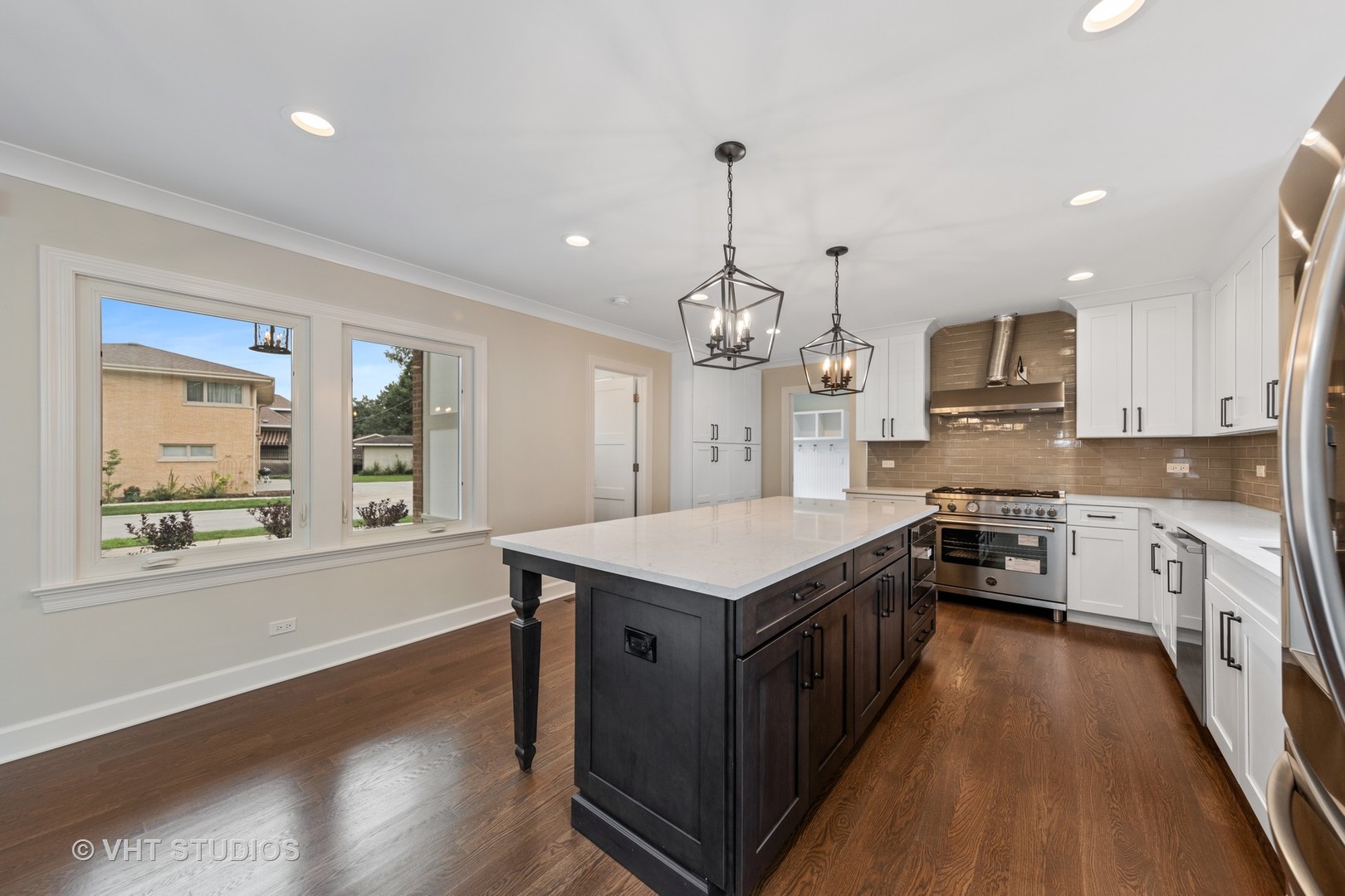 474 Uvedale Court Riverside, IL 60546 - Photo 8 of 23 a kitchen with granite countertop counter space a sink appliances and a large window