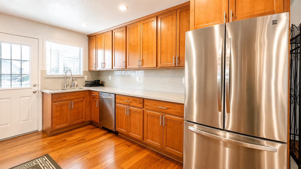 1281 Traynor Road Concord, CA 94520 - Photo 13 of 41 a kitchen with stainless steel appliances granite countertop a refrigerator and a sink
