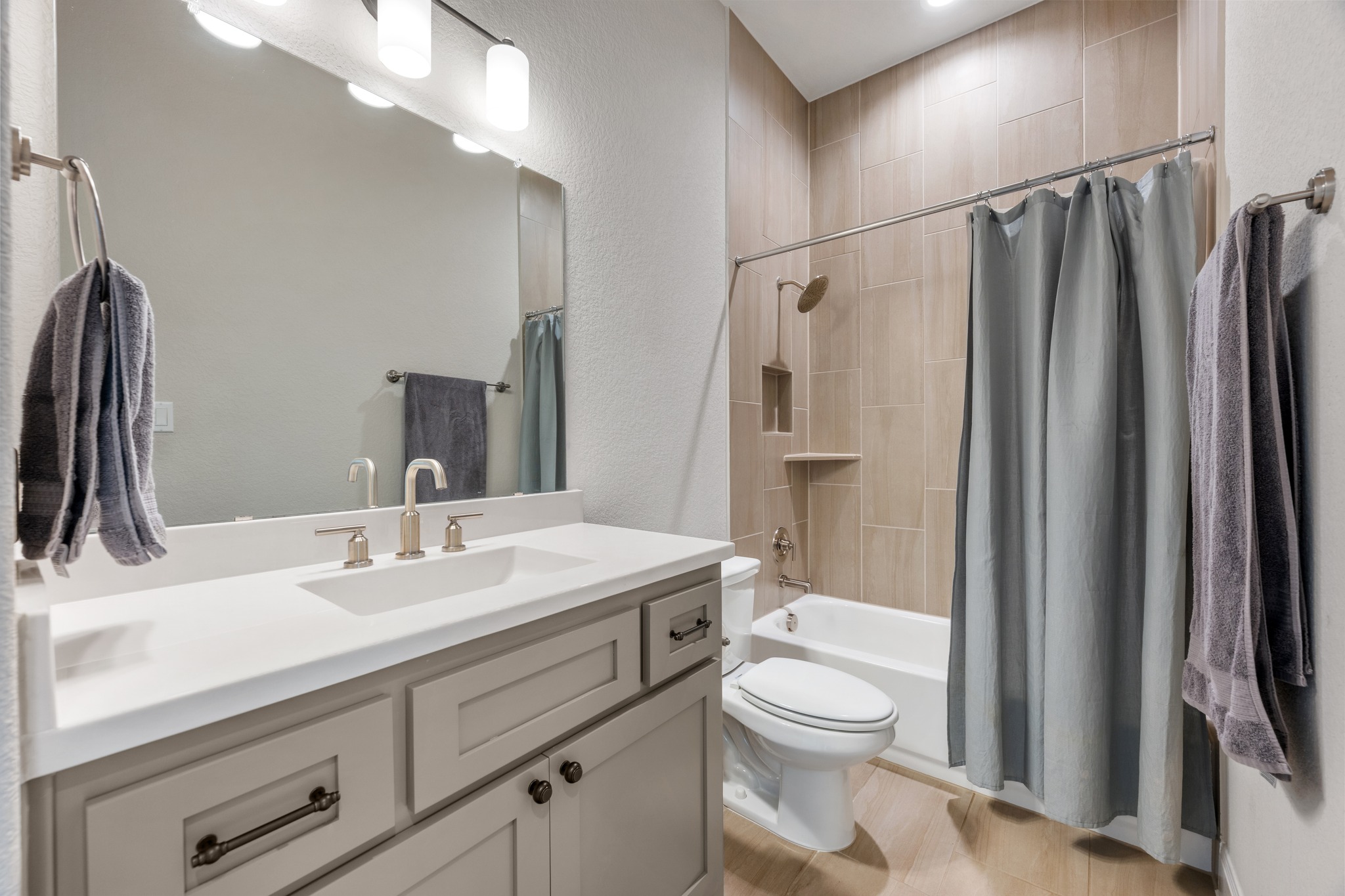 510 Elworth Path Austin, TX 78738 - Photo 16 of 40 a bathroom with a sink a toilet a mirror and shower