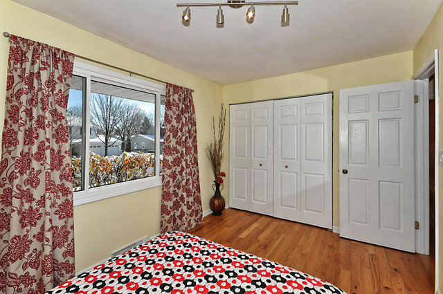 605 West Gilbert Road Palatine, IL 60067 - Photo 14 of 25 a bedroom with a bed and wooden floor